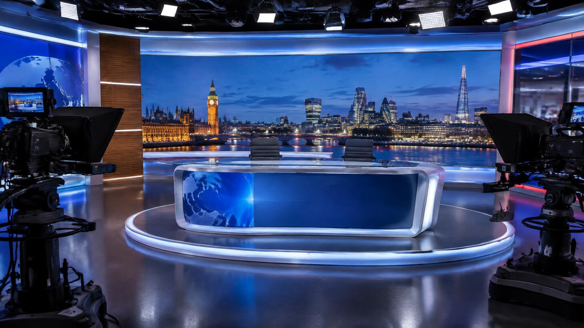 Modern television newsroom set with presenter desk and illuminated backdrop